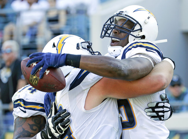 San Diego Chargers tight end Antonio Gates right celebrates with teammates after scoring a touchdown against the Jacksonville Jaguars during the first half of an NFL football game in Jacksonville Fla. Sunday Nov. 29 2015. (AP