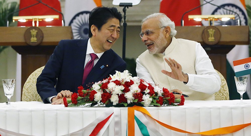 Japan's Prime Minister Shinzo Abe and his Indian counterpart Narendra Modi shares a moment during a signing of agreement at Hyderabad House in New Delhi India