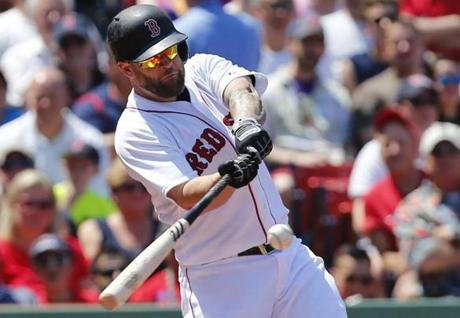 Boston Massachusetts- 5/24/2015- Boston Red Sox Mike Napoli hits a two run home run against the LA Angels during the second inning at Fenway Park in Boston Massachusetts