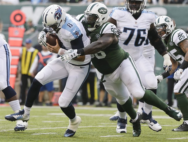 New York Jets defensive end Muhammad Wilkerson sacks Tennessee Titans quarterback Marcus Mariota during the first half of an NFL football game Sunday Dec. 13 2015 in East Rutherford N.J