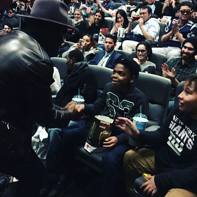 John Boyega greets a surprised young fan