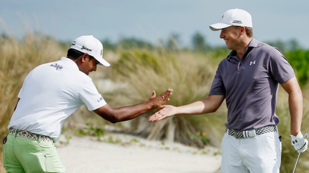 Jordan Spieth celebrates with Anirban Lahiri after Spieth's hole-in-one