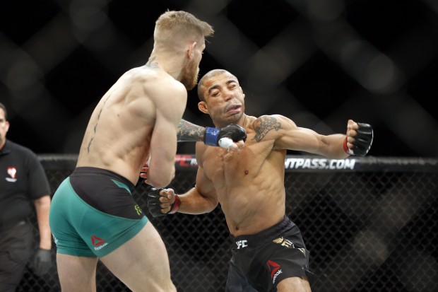 Conor Mc Gregor knocks out Jose Aldo during a featherweight championship mixed martial arts bout at UFC 194 Saturday Dec. 12 2015 in Las Vegas