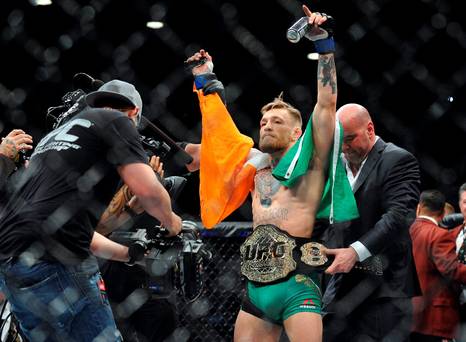 Conor Mc Gregor is declared the winner by knockout and crowned champion against Jose Aldo during UFC 194 at MGM Grand Garden Arena. Credit Gary A. Vasquez-USA TODAY Sports