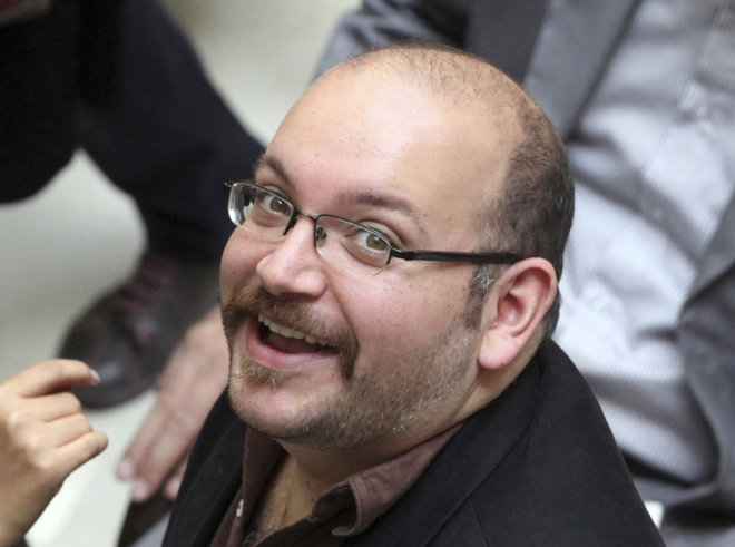 Jason Rezaian an Iranian American correspondent for the Washington Post smiles as he attends a presidential campaign of President Hassan Rouhani in Tehran Iran. Rezaian is one of the 19 journalists that