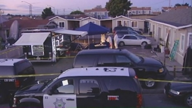 Police investigating the children's deaths at the scene as shown on US news reports