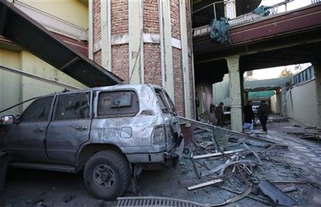 Afghan security personnel inspect the Spanish Embassy in Kabul Afghanistan Saturday Dec. 12 2015. Explosions and gunfire rocked a diplomatic area of central Kabul overnight as security forces tried to flush out Taliban attackers who claimed responsibi