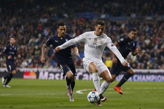 Ronaldo fights for the ball against Malmoâ€™s Yoshimar Yotun during a Champions League group A soccer match between Real Madrid and Malmo at the Santiago Bernabeu stadium in Madrid Tuesday Dec. 8 2015. (AP Pho