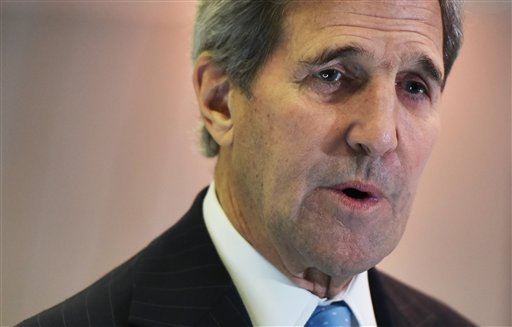 US Secretary of State John Kerry speaks to reporters following a meeting with France's Foreign Minister Laurent Fabius on the sidelines of the COP 21 United Nations conference on climate change in Le Bourget on the outskirts of Paris on Friday Dec. 11