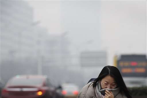 Beijing schools close as city issues 1st smog red alert