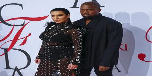 Television personality Kim Kardashian arrives with Kanye West to attend the 2015 CFDA Fashion Awards in New York