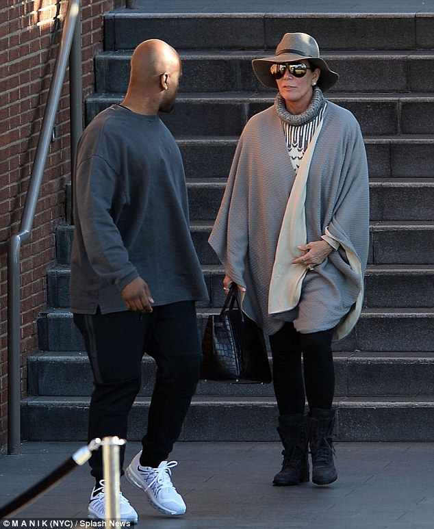 Covered up Kris Jenner wore a floppy hat sunglasses and grey wrap while having lunch with boyfriend Corey Gamble at the mall in Century City Los Angeles on Sunday