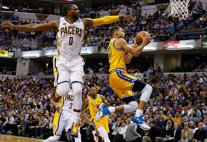 Dec 8 2015 Indianapolis IN USA Golden State Warriors guard Stephen Curry takes a shot against Indiana Pacers guard C.J. Miles at Bankers Life Fieldhouse. Golden State defeats Indiana 131-123. Mandatory Credit Brian Spurlock-USA TODAY Sports