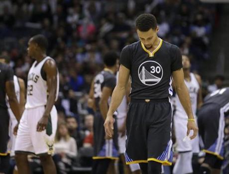 Golden State Warriors&apos Stephen Curry looks down during the second half of an NBA basketball game against the Milwaukee Bucks Saturday Dec. 12 2015 in Milwaukee. The Bucks won 108-95