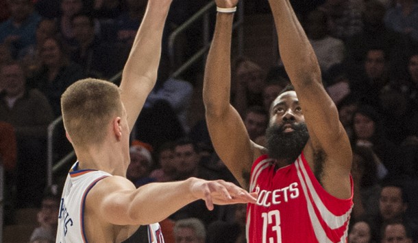 Nov 29 2015 New York NY USA Houston Rockets shooting guard James Harden shoots the ball over New York Knicks power forward Kristaps Porzingis defending during the 2nd qtr of the game at Madison Square Garden. The Rockets won 116-111. Grego