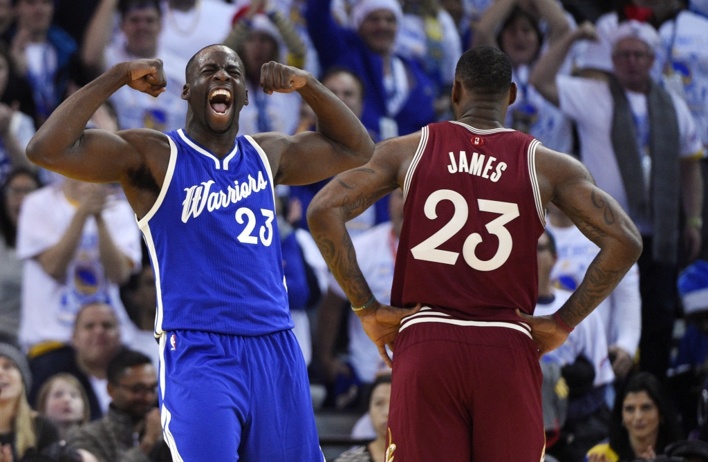 Dec 25 2015 Oakland CA USA Golden State Warriors forward Draymond Green reacts as Cleveland Cavaliers forward Le Bron James looks on in the first half of a NBA basketball game on Christmas at Oracle Arena. Mandatory Credit Kyle Terada