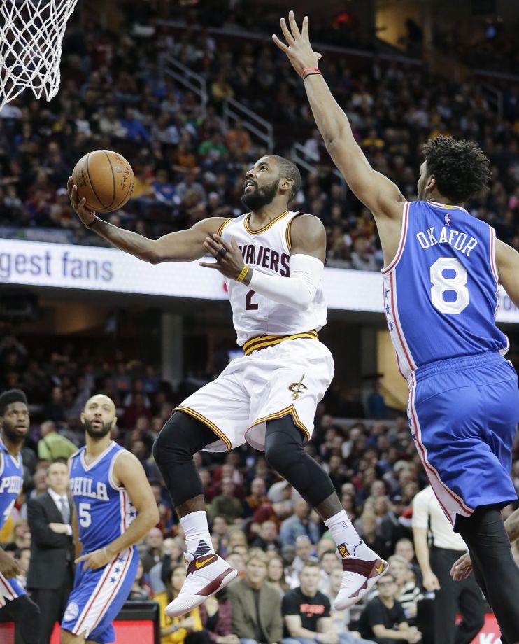 Cleveland’smKyrie Irving drives past Philadelphia’s Jahlil Okafor in his first game since Game 1 of the NBA Finals