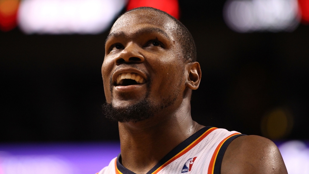 MIAMI FL- JANUARY 29 Forward Kevin Durant #35 of the Oklahoma City Thunder smiles during a game against the Miami Heat at American Airlines Arena