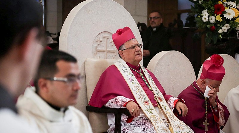 Latin Patriarch of Jerusalem Fouad Twal attends Christmas celebrations in the West Bank town of Bethlehem on Christmas Eve