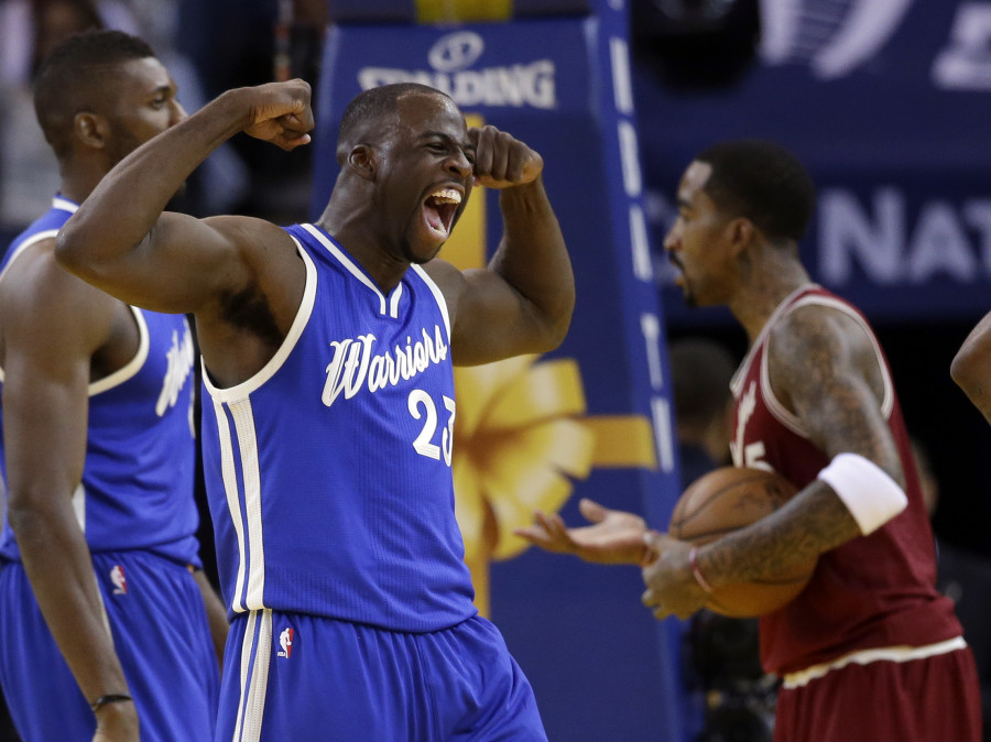 Golden State Warriors&#039 Draymond Green celebrates after scoring against the Cleveland Cavaliers during the first half of an NBA basketball game Friday Dec. 25 2015 in Oakland Calif