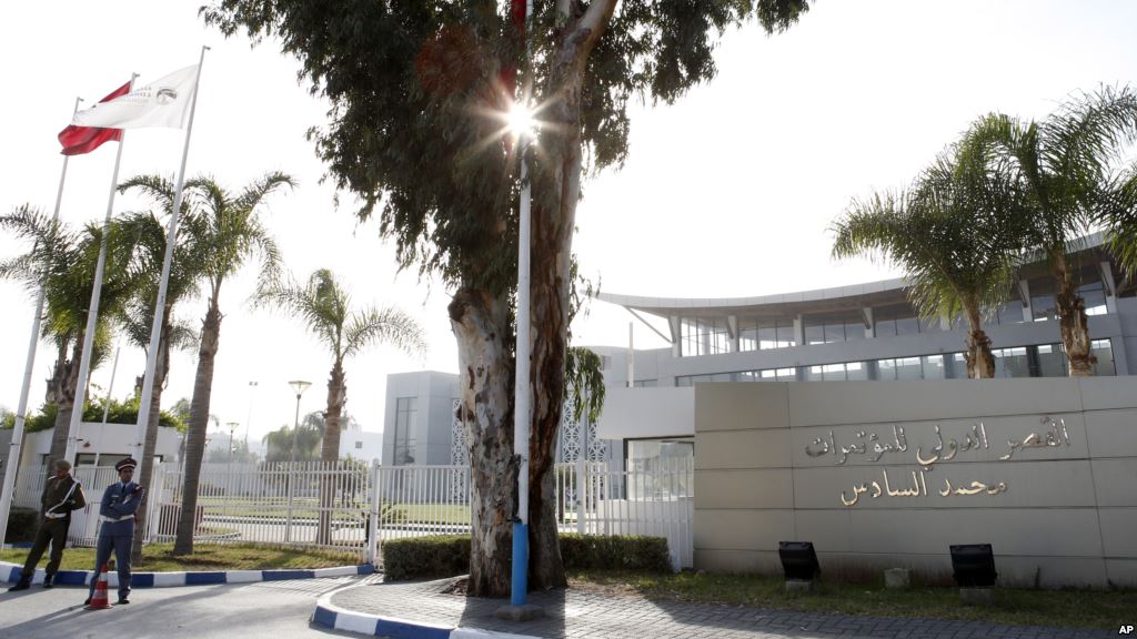 Police officers guard the International Conference Center where the signing of a U.N.-sponsored deal aiming to end Libya's conflict is expected to take place Wednesday Dec.16 2015