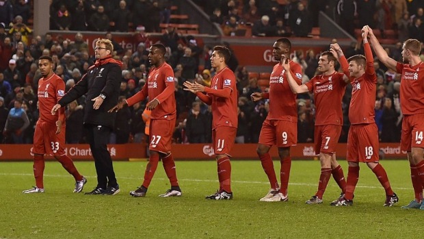 Jurgen Klopp leads his Liverpool players over to the Anfield Kop to salute the fans despite a having to salvage a 2-2 draw at home to West Bromwich Albion