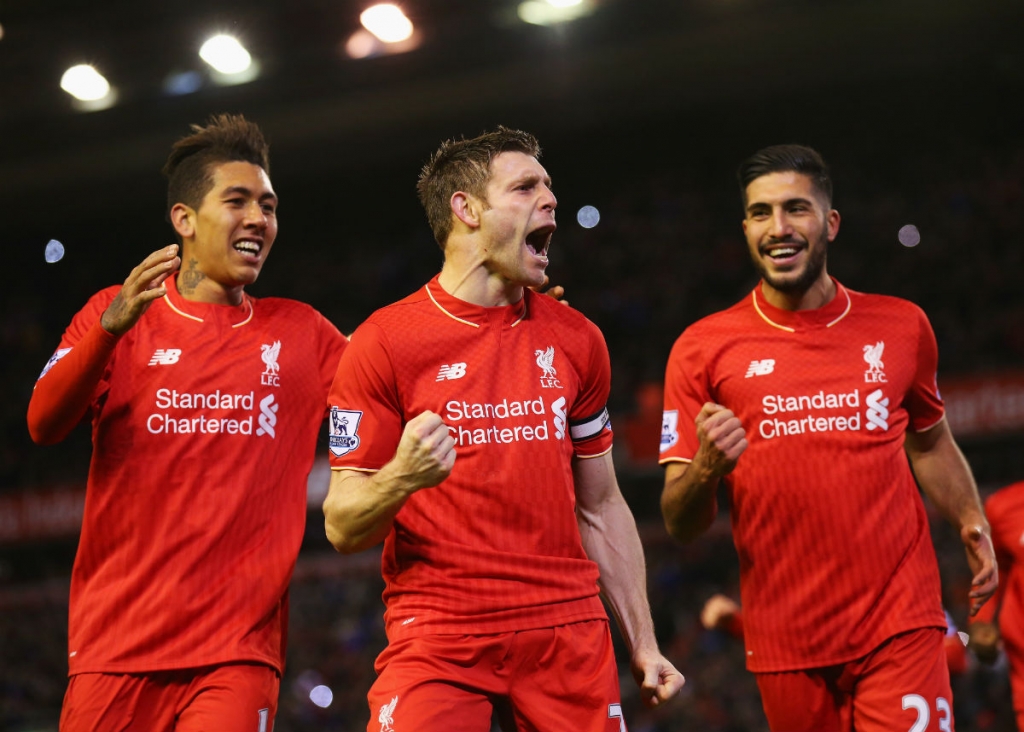 Liverpool midfielder James Milner celebrates his goal with Roberto Firmino and Emre Can