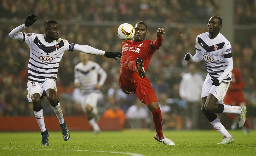 Liverpool's Christian Benteke in action with Bordeaux's Cedric Yambere and Ludovic Sane. – Reuters pic