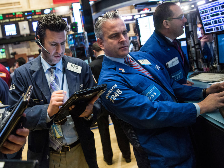 Traders work on the floor of the New York Stock Exchange