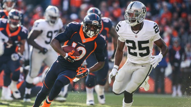 DENVER CO- DECEMBER 13 Wide receiver Emmanuel Sanders #10 of the Denver Broncos runs for an 11-yard gain and is pursued by cornerback D.J. Hayden #25 of the Oakland Raiders after a first quarter reception at Sports Authority Field at Mile High on Dece