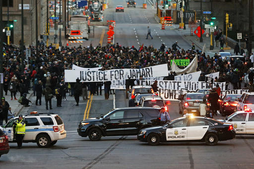 Hundreds of Black Lives Matter demonstrators and supporters occupy the street in front of the federal building Nov. 24 2015 in Minneapolis after marching from the Police Department's Fourth Precinct