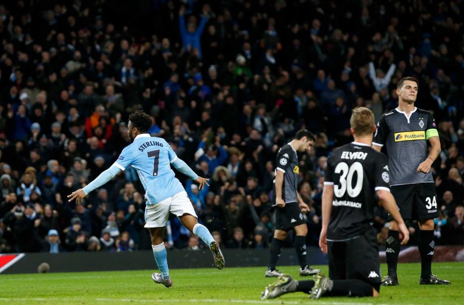 Manchester City's Raheem Sterling left celebrates scoring a goal during the Champions League Group D soccer match between Manchester City and Borussia Monchengladbach at the Etihad Stadium Manchester England Tuesday Dec. 8 2015