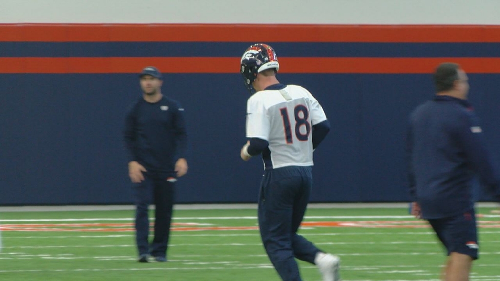 Manning back at practice