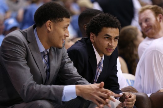 Marcus Paige and Justin Jackson look on from the sidelines