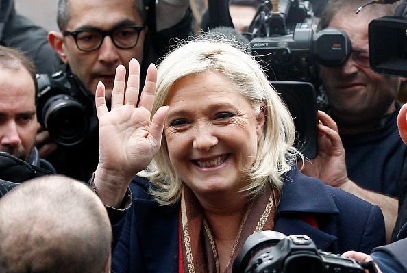 French far-right Front National party's president and FN candidate for the regional election in the Nord-Pas-de-Calais-Picardie region Marine Le Pen waves after voting of the regional elections