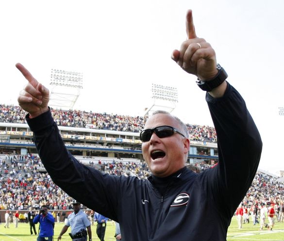 Georgia head coach Mark Richt celebrates as he walks off the field after his team defeated Georgia Tech 13-7 in an NCAA college football game in Atlanta Ga. Richt is stepping down after 15 seasons in what is being called a'mutual decision. Georgia athl