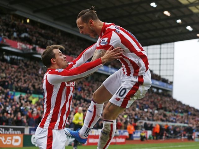 Marko Arnautovic celebrates with Xherdan Shaqiri after scoring the first goal for Stoke City