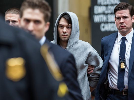 Martin Shkreli CEO of Turing Pharmaceutical is brought out of 26 Federal Plaza by law enforcement officials after being arrested for securities fraud on Dec. 17 2015 in New York