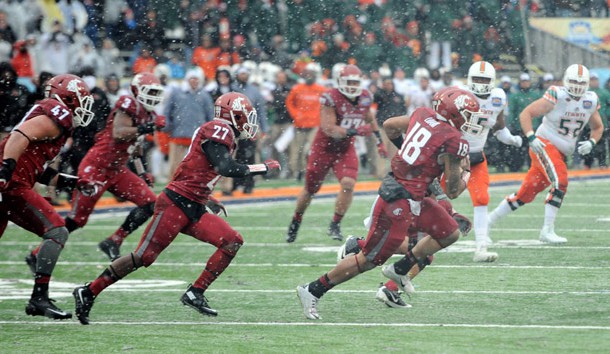 Dec 26 2015 El Paso TX USA Washington State Cougars safety Shalom Luani returns an interception against the Miami Hurricanes during the second half at Sun Bowl Stadium. The Cougars won 20-14. Mandatory Credit Joe Camporeale-USA TODAY Sports