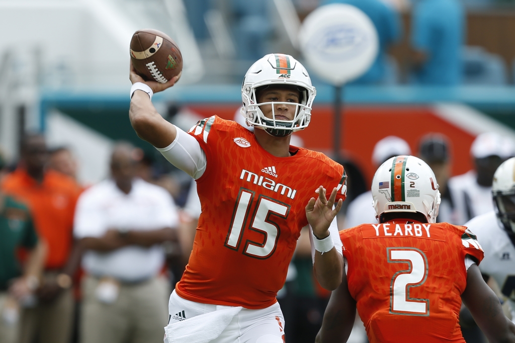 Brad Kaaya #15 of the Miami Hurricanes throws the ball during first quarter action against the Georgia Tech Yellow Jackets