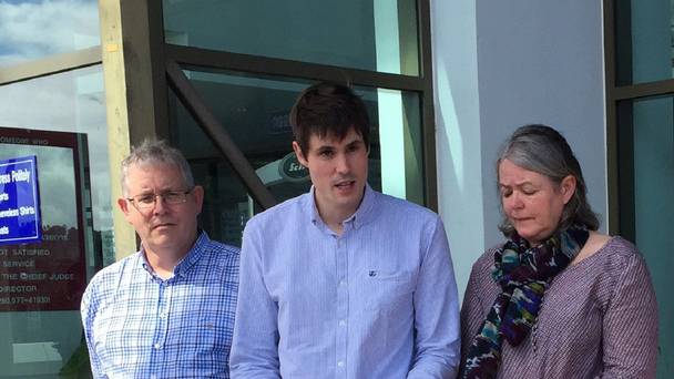 Michael Miller flanked by his parents Ian and Sue speaks after his brother's killers were sentenced to death