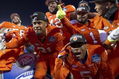 The Clemson Tigers celebrated after defeating the North Carolina Tar Heels 45-37 in the ACC football championship game at Bank of America Stadium