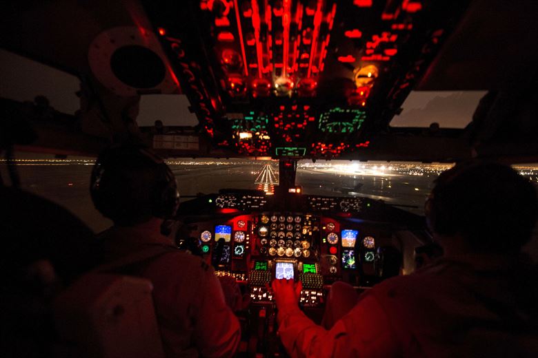 U.S. Air Force Capt. Mark Costa left and U.S. Air Force Maj. Joseph Corpening land a KC-135T Stratotanker after conducting a mission to support Operation Inherent Resolve over Southwest Asia Nov. 24 2015. Costa and Corpening are pilots assigned to the