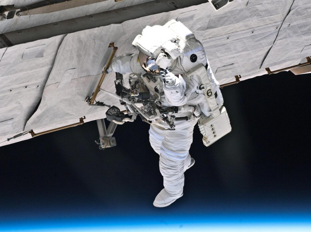 Nasa astronaut Garrett Reisman makes repairs to the ISS during a spacewalk in May 2010