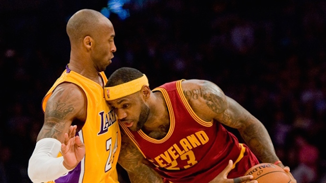 Cleveland Cavaliers forward Le Bron James tries to get around Lakers guard Kobe Bryant left late in the fourth period in Thursday's game Jan. 15 2015. AP