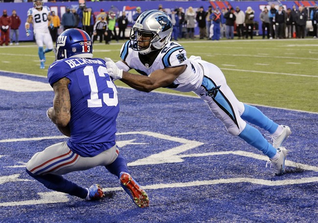 Carolina Panthers Josh Norman tackles New York Giants Odell Beckham in the end zone as Beckham scores a touchdown during the second half of an NFL football game Sunday Dec. 20 2015 in East Rutherford N.J