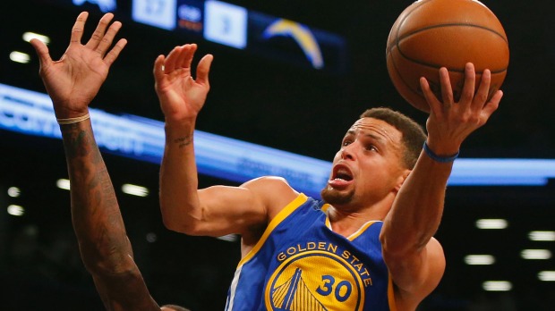 Golden State Warriors guard Stephen Curry drives to the basket against the Brookyn Nets at Barclays Center