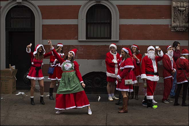 Hundreds in costumes revel at festive SantaCon