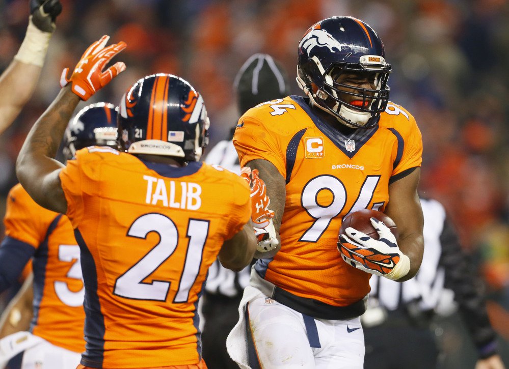 Denver linebacker De Marcus Ware celebrates his fumble recovery which sealed the Broncos’ win over the Cincinnati Bengals in overtime Monday night