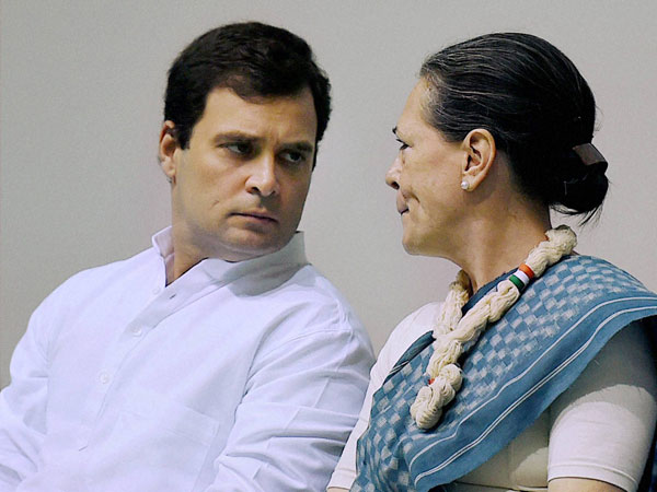 India Congress Party President Sonia Gandhi talks with Vice President Rahul Gandhi during a Congress Working Committee meeting in New Delhi